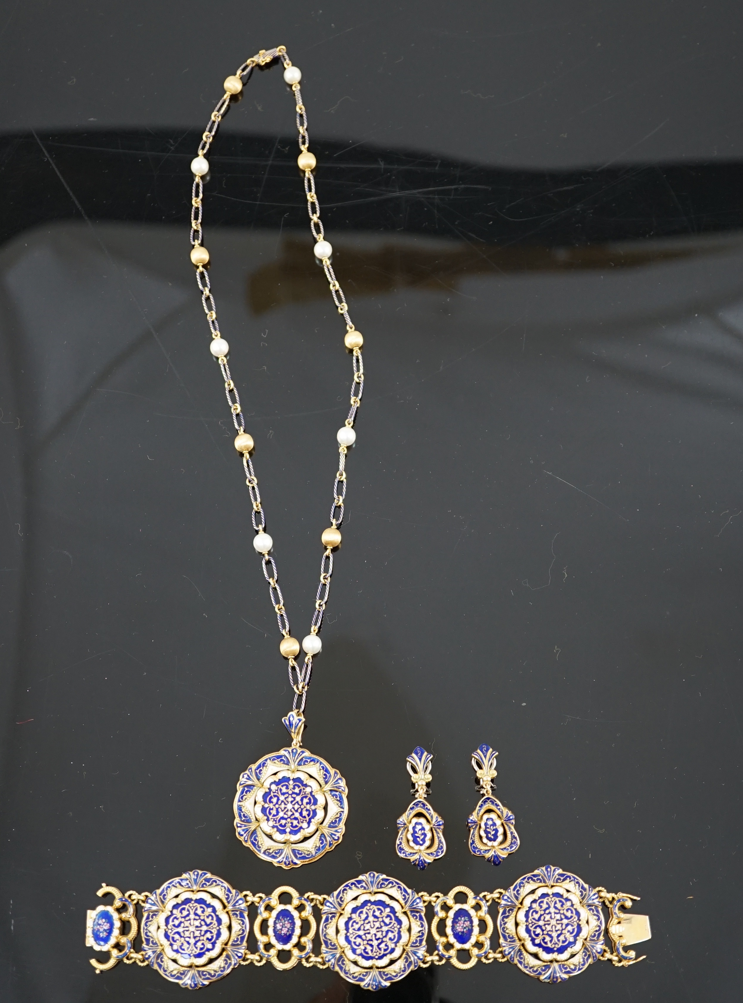 A late 19th century Swiss 18ct gold and polychrome enamelled suite of jewellery, retailed by E. Meister, Zurich